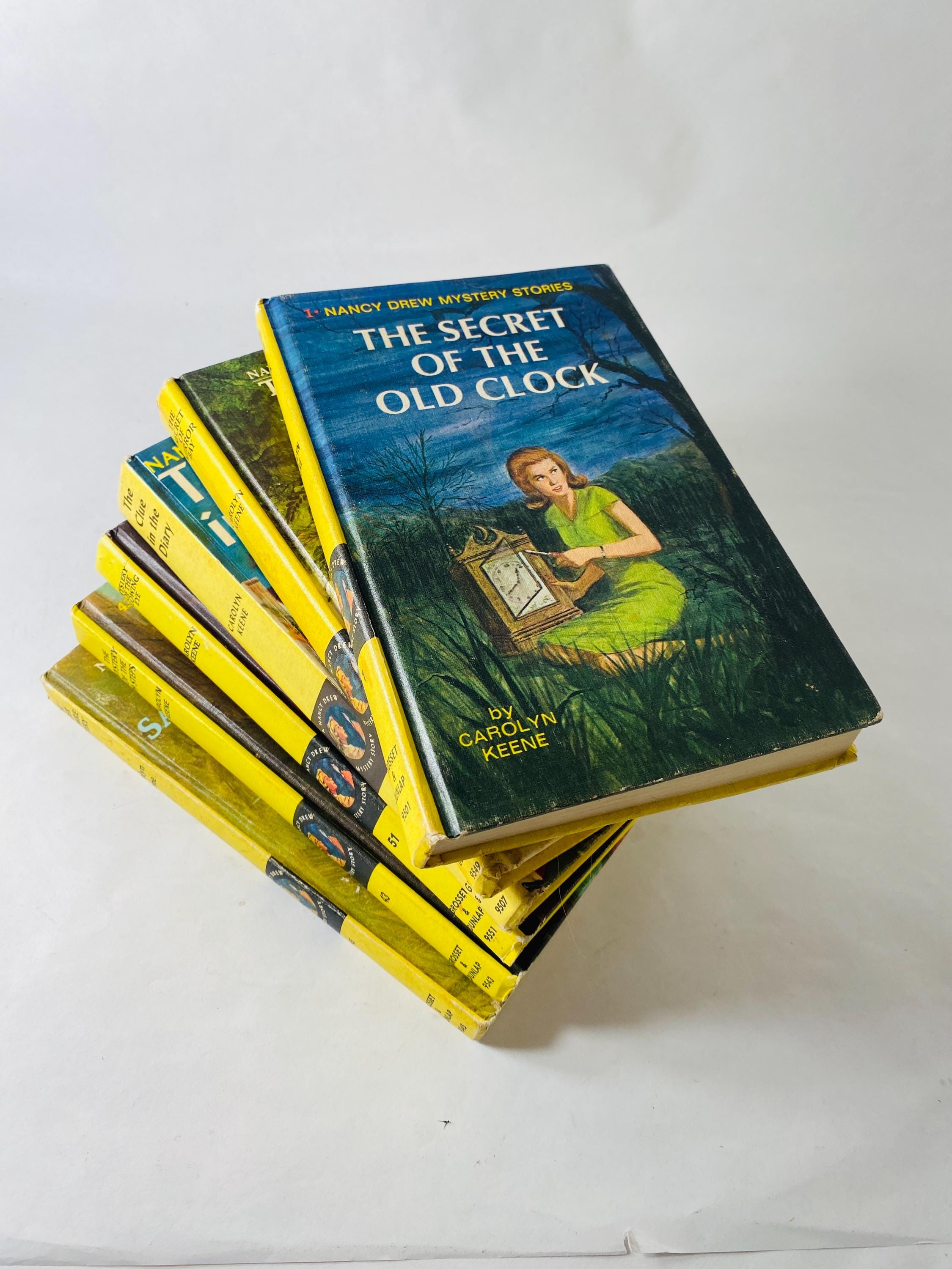 Nancy Drew Mystery Stories 1960s 1970 by Carolyn Keene. Vintage picture cover books with black & white endpapers. Teen tween reading yellow