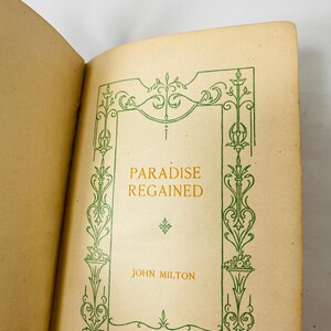 May include: Open book with the title "Paradise Regained" in gold lettering. The book's cover features a green decorative border and the author's name, John Milton. Published by The F. M. Lupton Publishing Company.