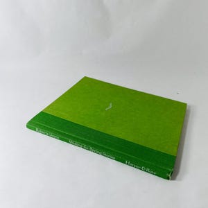 May include: A hardcover book titled "Waiting for Spring Stories" by Roberts/Joyce. The book has a bright green cover with a darker green band at the bottom. The publisher is Harper & Row. A small white design is on the cover.