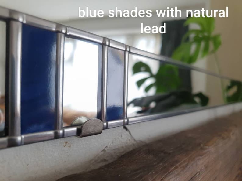 May include: A handmade, wooden serving tray with a natural finish. The tray features a rectangular shape with rounded corners and two handles. The wood grain is visible, adding to its rustic charm. Dimensions: 18 inches long, 12 inches wide, and 2 inches high.