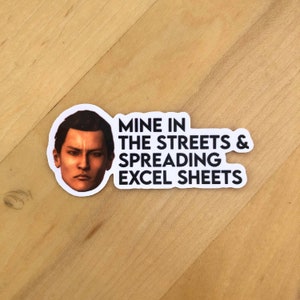 May include: White sticker with a black and white image of a man's face and the text "Mine in the streets & spreading excel sheets".