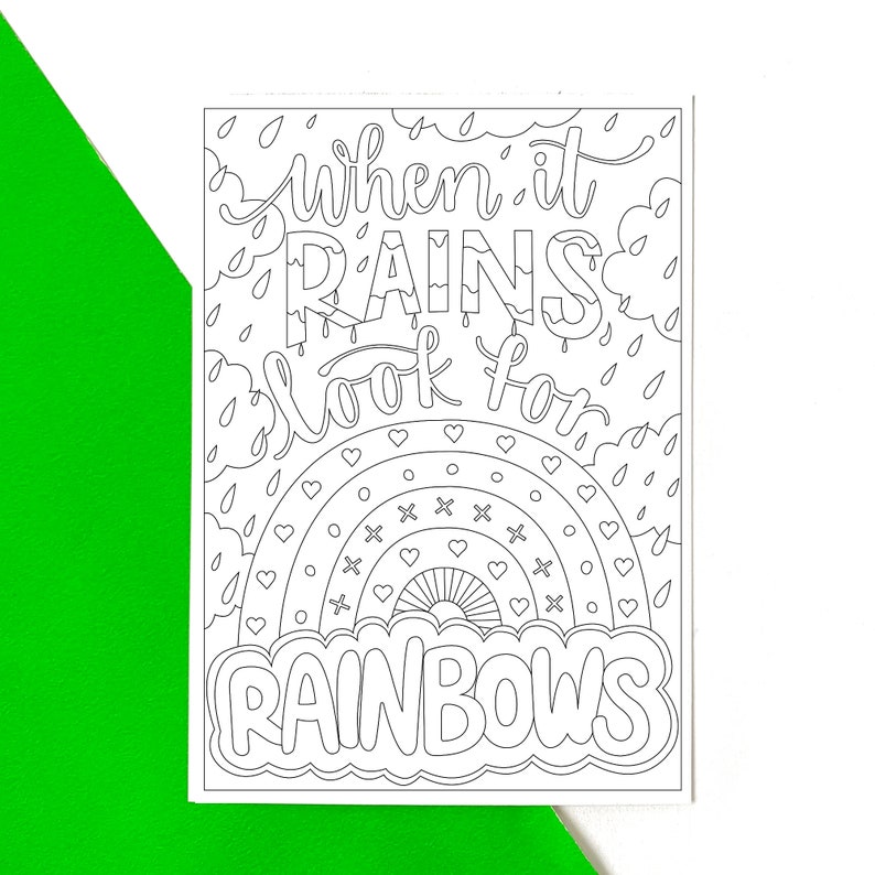 May include: A black and white colouring page with the text "when it rains look for rainbows" and a rainbow with hearts and x's inside.