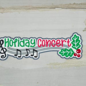 May include: A green and red holiday concert banner with musical notes and a holly sprig.