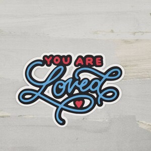 You are loved paper pieced die cut title for scrapbooking, card making, and keepsake items