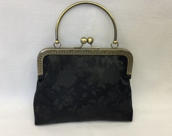 Bolso de noche de brocado satinado, bolso de mano negro con estampado floral y marco dorado