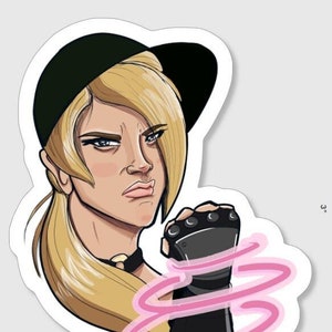 May include: A sticker featuring a cartoon illustration of a woman with blonde hair wearing a black cap and a black glove with pink glowing energy around it.