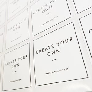 May include: White square labels with black text that reads "Create Your Own" with a line underneath and "Personalized Text" below the line.