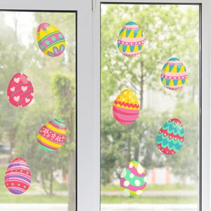 May include: Colorful Easter egg window clings in various designs, including stripes, polka dots, and floral patterns. The eggs feature bright colors like pink, yellow, green, and blue. These decorative clings are perfect for Easter.