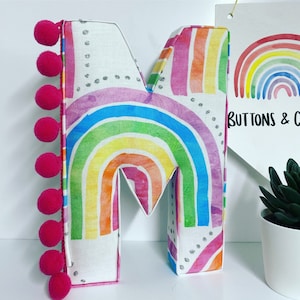 Rainbow Fabric Letter: Handmade Nursery Decor with Pom Pom Trim
