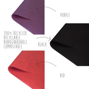May include: Three sheets of tissue paper in red, black, and purple. The tissue paper is 100% recycled, recyclable, biodegradable, and compostable.
