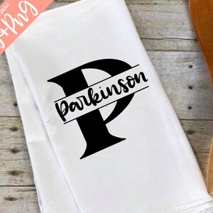 May include: White kitchen towel with a black letter P and the name "Parkinson" printed across the top of the letter.