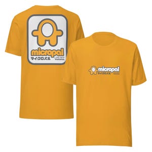 May include: A yellow t-shirt with a gray and white logo on the front and back. The logo is a stylized figure with the text "micropal" and "マイクロパル" below it.