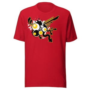 May include: Red t-shirt with a black and yellow abstract design featuring circles, swirls, and lines.