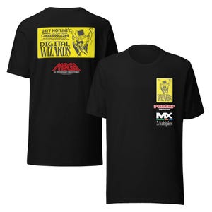 May include: Black t-shirt with a yellow graphic on the back that says "24/7 HOTLINE SPEAK TO THE PROS 1-900-999-4269 DIGITAL WIZARDS MEGA" and a yellow graphic on the front that says "DIGITAL WIZARDS raster MX Multiplex"