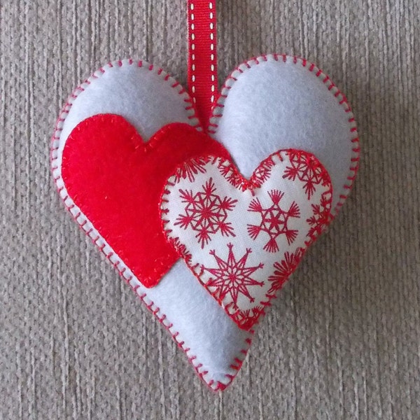 A handmade Scandi Nordic red and gray felt love heart door hanging decoration