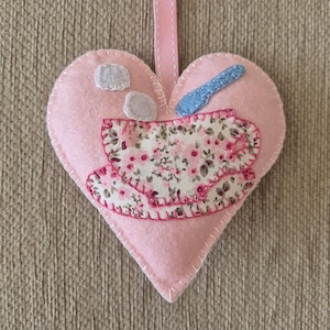 A handmade cup of tea pink felt heart door hanging decoration. Tea time decor.