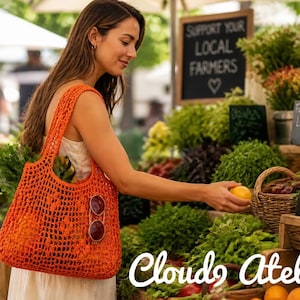 May include: A bright orange crochet tote bag with an open-knit mesh pattern and two shoulder straps. The bag features a pair of round sunglasses clipped to the front. The text Cloud9 Atelier is displayed in white script at the bottom of the image.