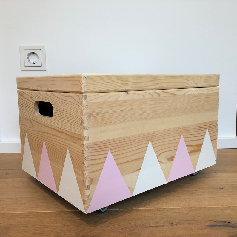 Wooden Toy Box Wheels Triangle White Pink Lid Wooden Toy Box Wheels Triangle White Pink Lid Image 0