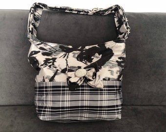 Black and white bag with adjustable handle