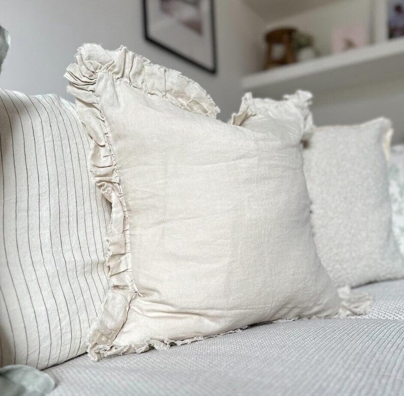 cream cushion with a ruffled edge