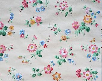 May include: A vintage floral wallpaper pattern with a beige background and a repeating pattern of pink, red, yellow, blue, and green flowers.