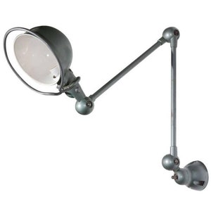 May include: A gray metal wall-mounted lamp with a white shade and a long, adjustable arm. The lamp has a swiveling head and a ball joint for easy positioning.