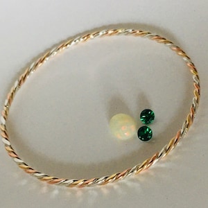 14 kt, 18 kt of 22 kt goud, puur zilver (99,9) en puur koperen gevlochten armband. Harmoniserend en uitgebalanceerd. Goudsmid handgemaakt. Gratis verzending
