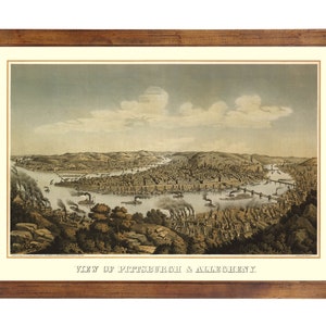 May include: An antique lithograph print depicting a panoramic view of Pittsburgh and Allegheny, Pennsylvania. The print shows the city's skyline, rivers, and bridges in a detailed and colorful style. The text "VIEW OF PITTSBURGH & ALLEGHENY" is printed at the bottom of the image.