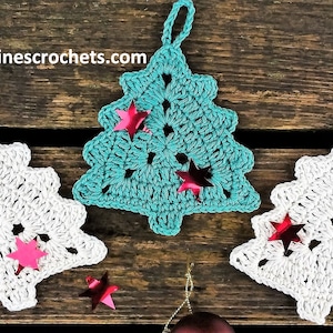 May include: Three crocheted Christmas tree decorations, one teal, two white, with red glitter stars.