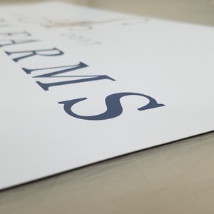 May include: A white sign with the text "The Farm" and "Wedding Venue" in a dark blue font.