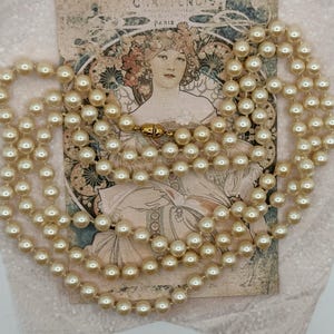Vintage MONET Faux Pearl 54 inches long Necklace with Gold Plated Clasp