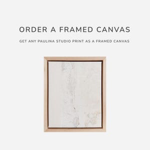 a picture frame with a picture of a white wall