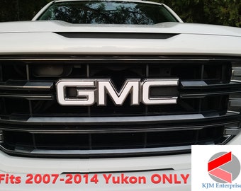 May include: Close-up of a white GMC Yukon with a black grille. The GMC logo is in silver and the text "Fits 2007-2014 Yukon ONLY" is in red.