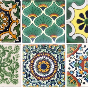 May include: Twelve colorful ceramic tiles with intricate geometric and floral patterns in shades of green, yellow, blue, red, and white.
