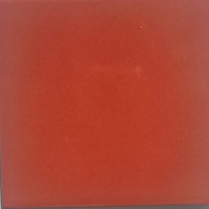 May include: A solid red square tile.