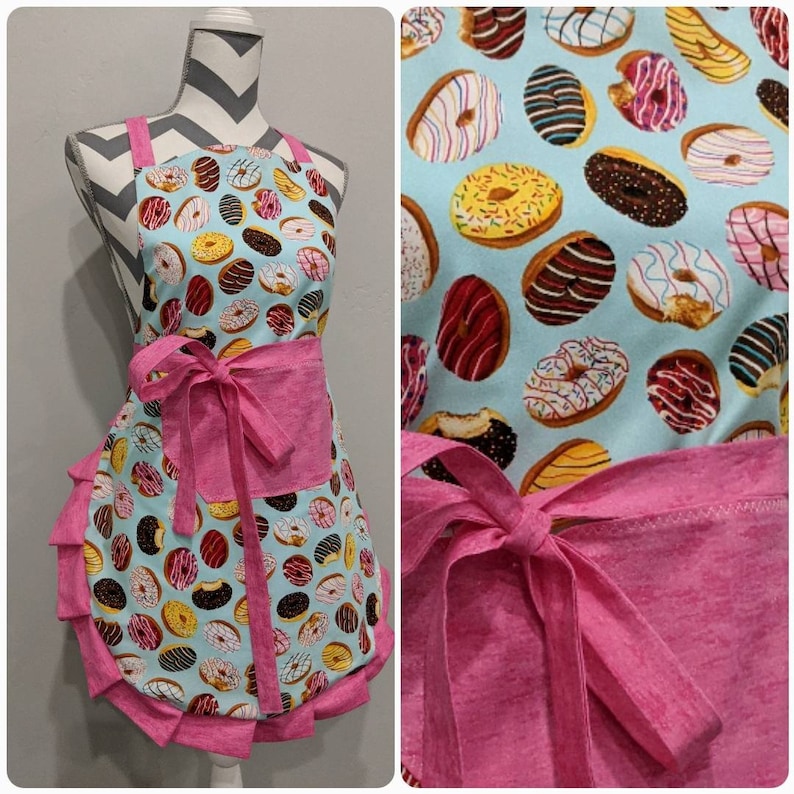 Multi-colored frostedsprinkled donuts on main Bright pink and pocket ties and frills. Women/'s apron Adult apron