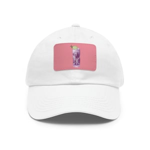 May include: White baseball cap with a pink patch featuring a purple cocktail with a lime wedge on top.