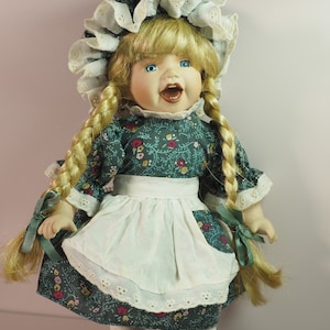 Vintage porcelain collectible character doll. Germany.