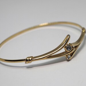 Vintage designer hard women's bracelet with crystal inserts.