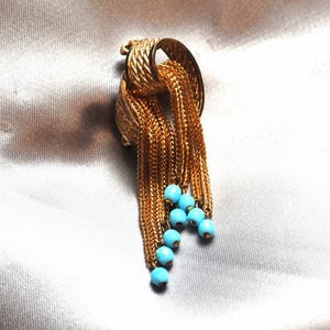 Vintage retro modernist abstract waterfall brooch from the 1960s mid-century with turquoise.