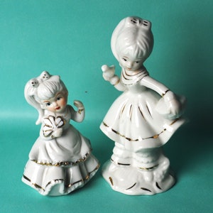 Two vintage porcelain figurines.