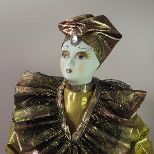 Antique collectible porcelain doll Harlequin.