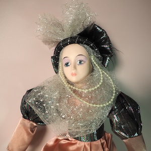 Vintage porcelain decorative collectible Harlequin doll.