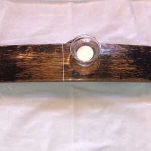 Burbon stave outside up with glass candle holders.