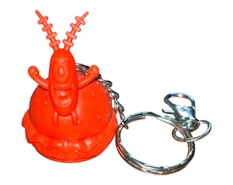 Mini figura de goma reciclada y reutilizada del antagonista rojo, llavero con clip para mochila