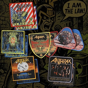 May include: A collection of embroidered fabric patches featuring various Anthrax band album art and logos. Designs include Judge Dredd with the text I AM THE LAW, For All Kings, The Greater of Two Evils, Stomp 442, Persistence of Time, and Armed and Dangerous.