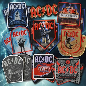 Könnte beinhalten: Ein Set aus drei Keramikbechern mit gesprenkelter, matter Oberfläche. Die Becher sind in Creme-, Hellgrau- und Dunkelgrautönen gehalten. Jeder Becher hat ein schlichtes, minimalistisches Design und einen abgerundeten Griff.