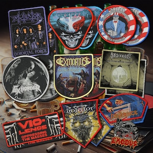 May include: A collection of various embroidered fabric patches featuring band logos and album artwork, including designs for Mutilator, Forbidden, Exhorder, Exmortus, Insanity, Vio-lence, Protector, Defiance, and Exodus, with diverse shapes and colors.