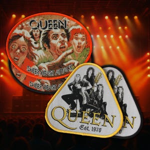 May include: A round embroidered patch featuring the Queen Sheer Heart Attack album cover with an orange border, alongside two triangular embroidered patches with a yellow border depicting the band members and the text Queen Est. 1970.