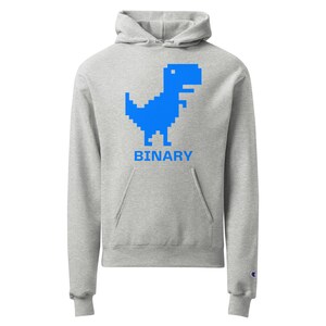 Op de afbeelding: Een grijs hoodie met een blauwe gepixelde dinosaurus en het woord "BINARY" erop gedrukt.